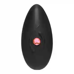 Black oval silicone sex toy with a pink gem accent at the center.