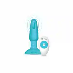 Turquoise wireless vibrator with ribbed base and a white remote control beside it.