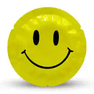 Yellow round condom wrapper with a black smiling emoji face